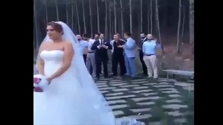 Newlywed bride throwing bouquet to...