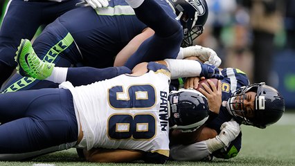 Aaron Donald forces an unusual backwards pass by Russell Wilson for 23-yard loss