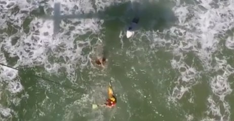 Swimmers Caught in Rip Hoisted to Safety by Rescue Helicopter