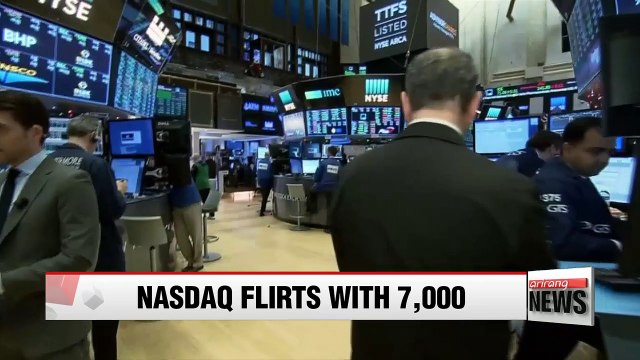 NASDAQ flirts with 7,000 mark for first time during trading