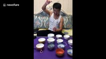 Man plays Chinese tunes on rice bowls with chopsticks