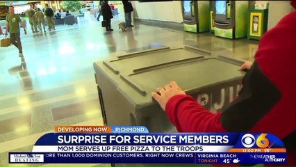 Mother Hands Out Pizzas to Troops Heading Home for the Holidays
