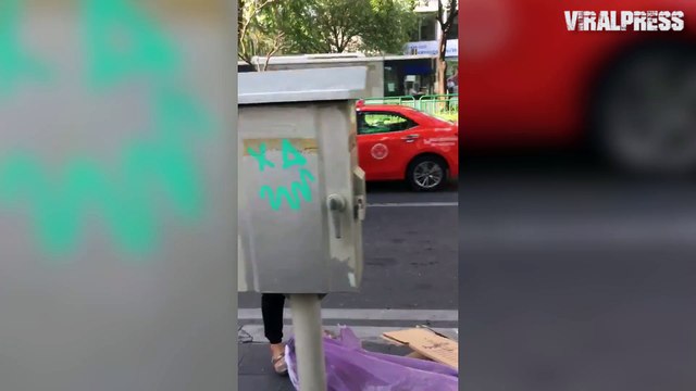 Female Tourist Graffiti Tags In Broad Daylight