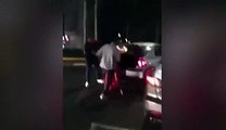boyfriend tries to bundle woman into boot of his car