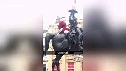 Glasgow Santa waves to crowd before being removed by police