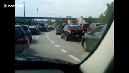 Colleagues laugh at driver struggling with manual car