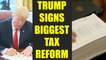 US President Donald Trump signs biggest tax reform to boost jobs, Watch | Oneindia News