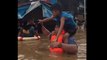 Rescue Crews Wade Through Chest-High Philippines Floodwater