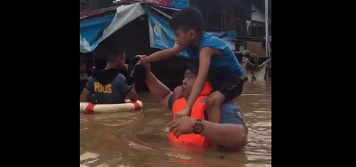 Rescue Crews Wade Through Chest-High Philippines Floodwater