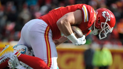 Travis Kelce leaps for an 18-yard throw from Smith