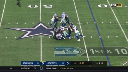 Taco Charlton barrels through to bear hug sack Wilson