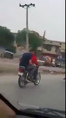 What These Boys Are Doing with girl while riding a bike