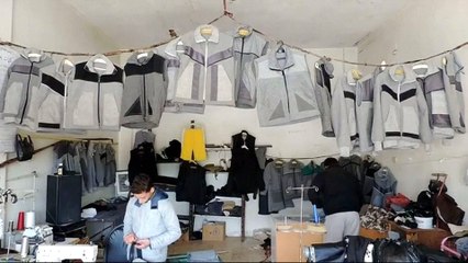 Syrians turn old blankets into winter coats to survive