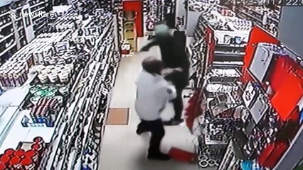 CCTV shows hero shopkeeper using karate skills to disarm gunman