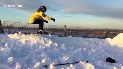 Teenagers make ski track in snowy Wiltshire countryside