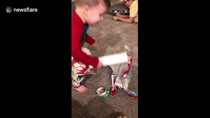 Two-year-old is thrilled with a banana for Christmas