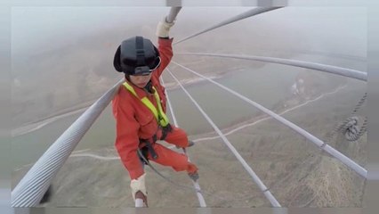 Workers make final checks on China's new power line