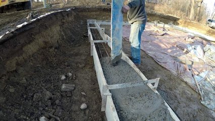 Digging a foundation and pouring a footing