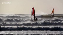UK windsurfers, swimmers brave New Year's Day cold