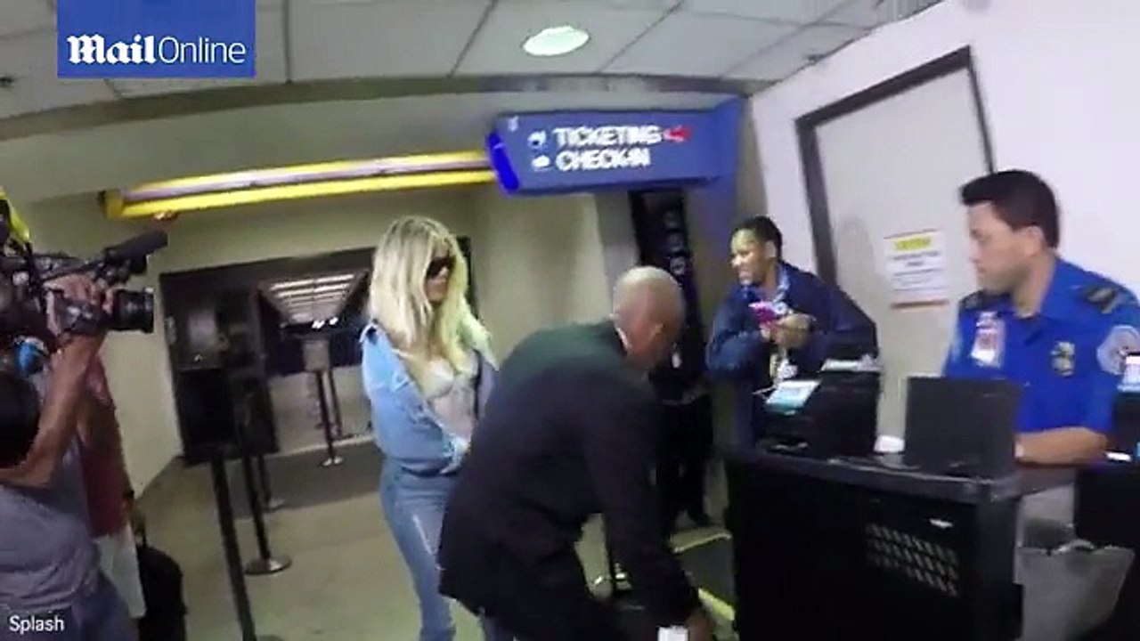 Khloe Kardashian departs from LAX in lacy white LINGERIE