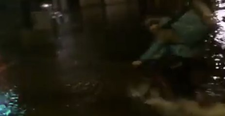 Delivery Cyclist Struggles Through Flood Water During Storm on Ireland's West Coast