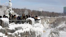 Niagara Falls partially frozen over in North American cold snap