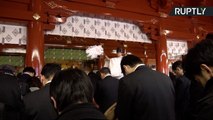Japanese Businessmen Pray to Business Gods for Successful Year