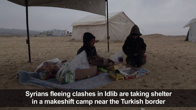 Displaced Syrians take shelter in a makeshift camp