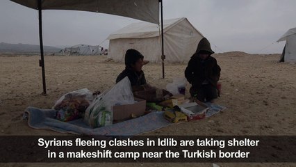 Displaced Syrians take shelter in a makeshift camp