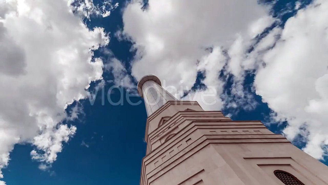 Blue Sky And Clouds Above The Peak Of The Tower Of White Mosque. Kazakhstan by Timelapse4K