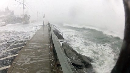 Cameraman takes direct hit in Massachusetts floods