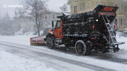 Snow ploughs clear Boston during massive storm