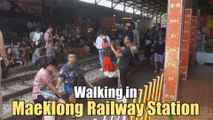 Walking in Maeklong Railway Station