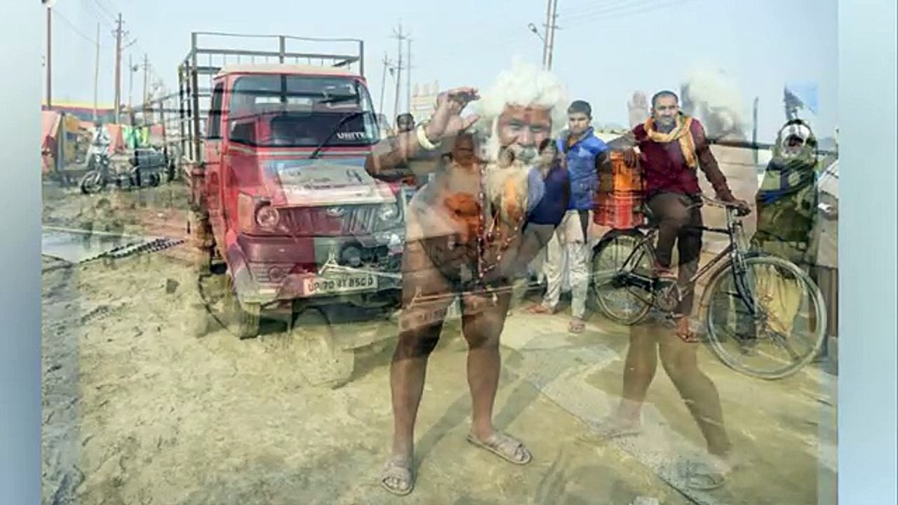 Naked Hindu monk p ulls van with his PENIS as hundreds of thousands gather for religious