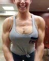 Girl bodybuilder flexing muscle