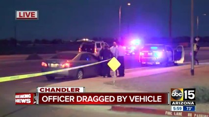Officer dragged by suspect's vehicle, suspect still on the run