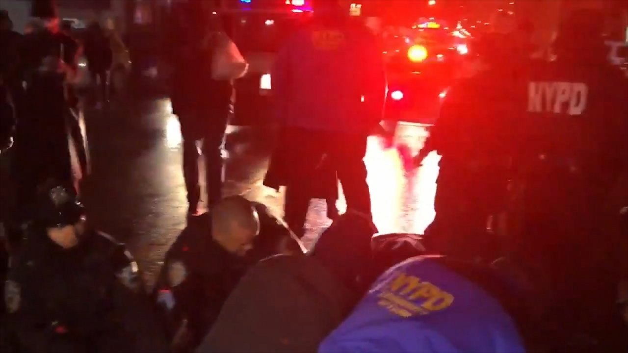 Hours after Erica Garner's funeral, police officers arrest protester at rally in her honour