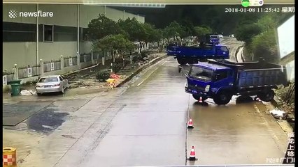 Security camera captures bizarre accident on Chinese road