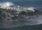 Drone Captures Bird's-eye View of Surfers Riding Waves in Nazaré, Portugal