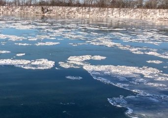 Ice Floes Drift Along New York's Niagara River Towards Lake Ontario
