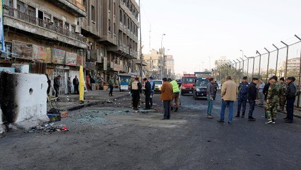Iraq: dozens killed as suicide bombers hit Baghdad market