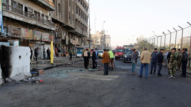 Iraq: dozens killed as suicide bombers hit Baghdad market