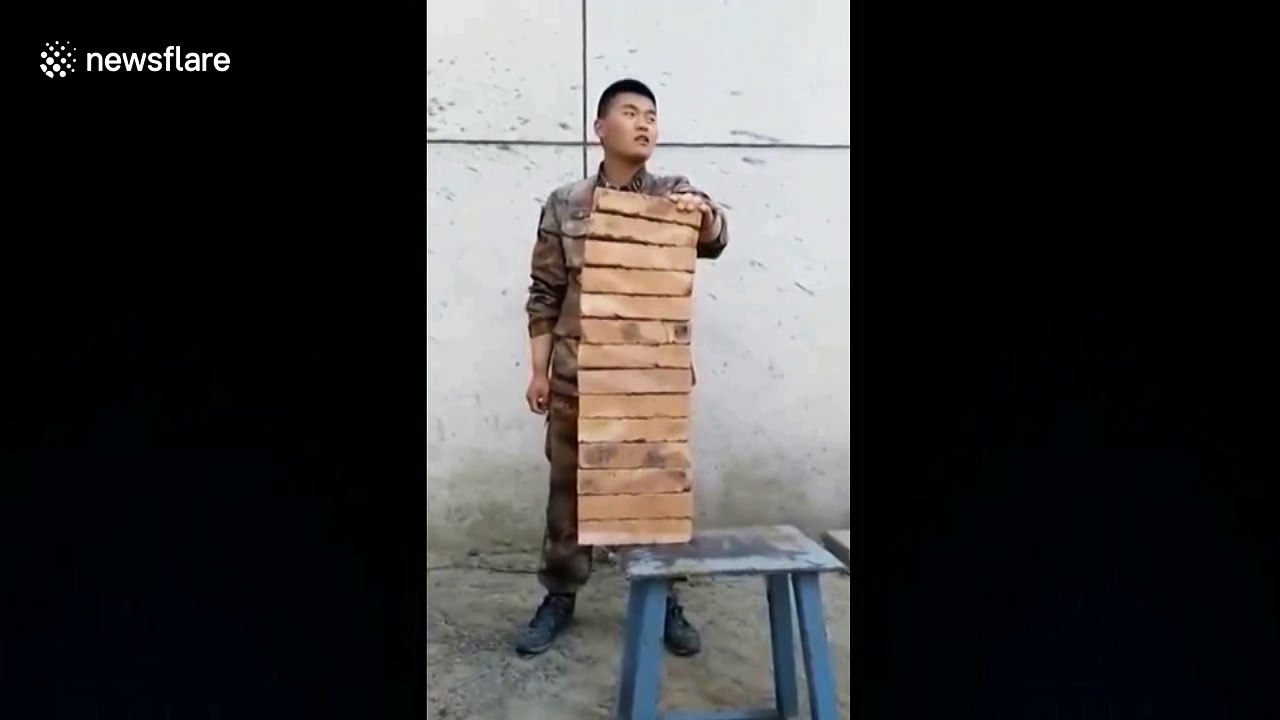 Chinese soldier 'breaks 14 bricks using his hand'