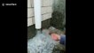 Ice falling from drainpipe is mesmerising