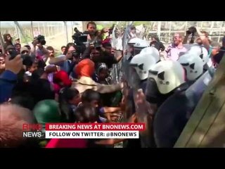 Tension boils over in Greece as angry migrants stuck in a makeshift camp