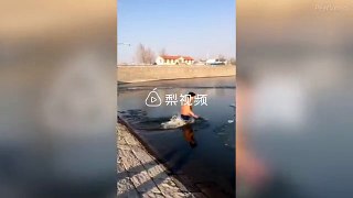Chinese man is saved after he dived and trapped under ice