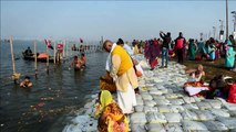 Hindu pilgrims take a holy bath in the Ganges