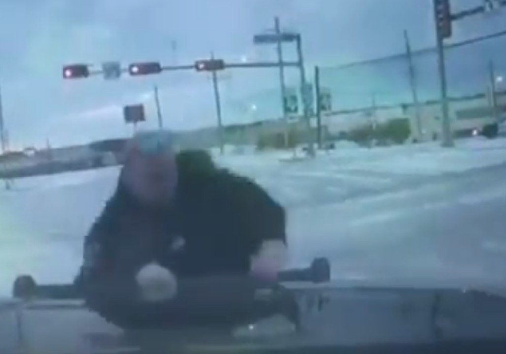 Texas Police Officer Slips, Slides on Ice While Directing Traffic