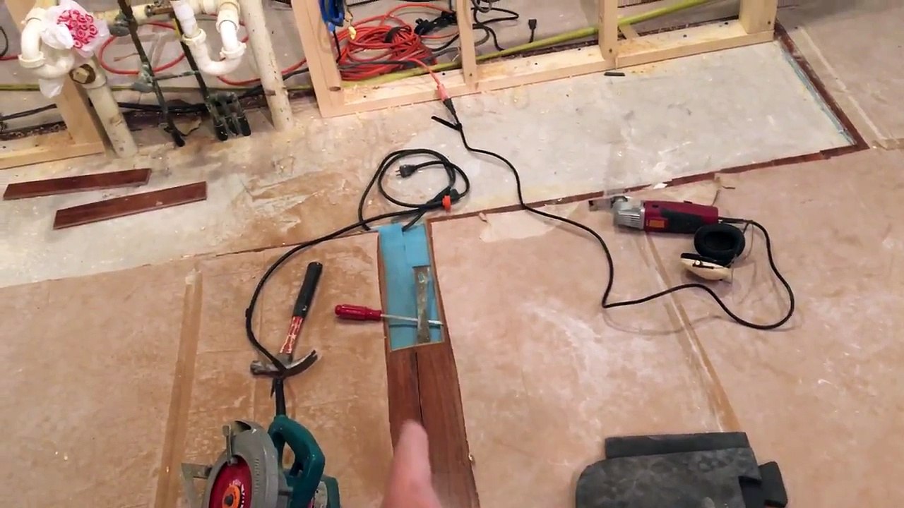 Remove one piece of laminate flooring from the middle of a floor