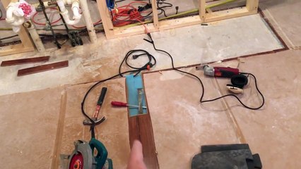 Remove one piece of laminate flooring from the middle of a floor